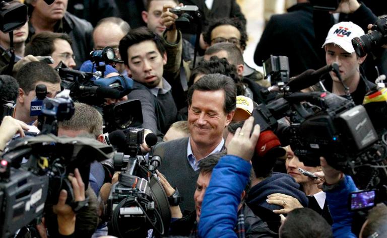 Romney edges Santorum in Iowa photo finish