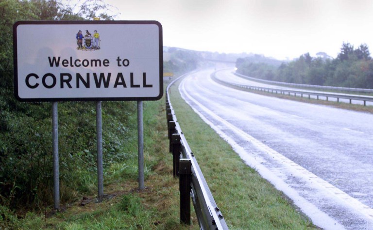 FILE - This Aug. 8, 1999 file photo shows a road sign on the road going into Cornwall, in Launceston, England, Thursday April 24, 2014. The British government said Thursday April 24, 2014 that Cornish people have been given the same status as Scots, Welsh and Irish _ the U.K.'s other Celtic peoples _ under European Union law protecting national minorities. (AP Photo/PA, Toby Melville) UNITED KINGDOM OUT  NO SALES  NO ARCHIVE