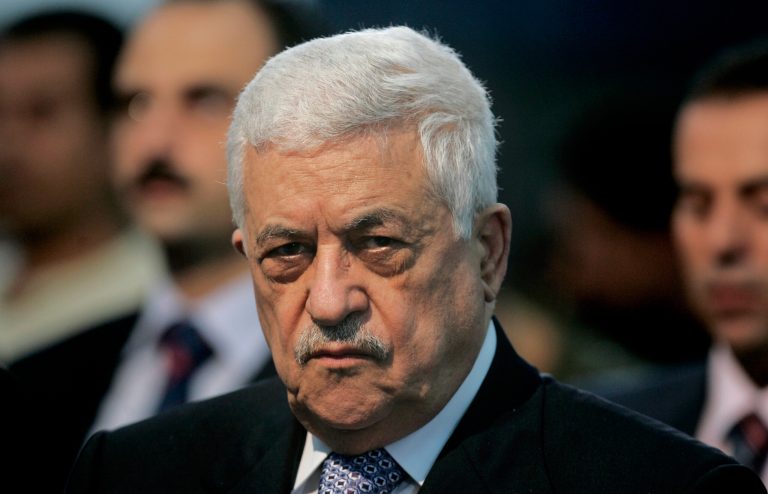 File -- In this Friday, Oct. 26, 2007 file photo, Palestinian President Mahmoud Abbas, attends Muslim prayers at a mosque adjacent to his office in the West Bank city of Ramallah. Abbas called the Holocaust 