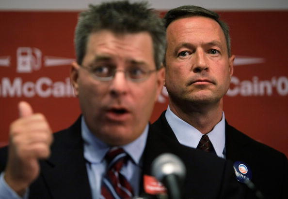 WASHINGTON - FILE:  Maryland Gov. Martin O'Malley (R) listens as DNC Senior Communications Adviser Brad Woodhouse (L) speaks during the launch of an 
