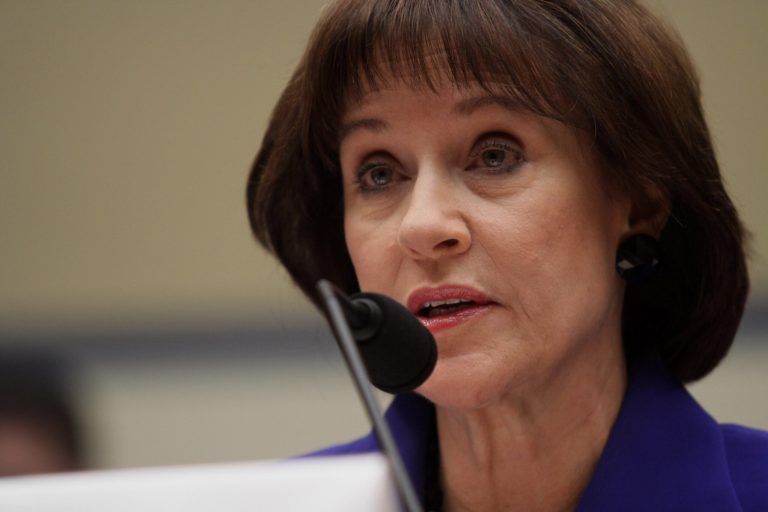 FILE - In this March 5, 2014, file photo, former Internal Revenue Service (IRS) official Lois Lerner speaks on Capitol Hill in Washington. The Justice Department is investigating the circumstances behind the disappearance of emails from Lerner, part of a broader criminal inquiry into whether the agency had targeted conservative groups seeking tax-exempt status, according to congressional testimony released Wednesday. (AP Photo/Lauren Victoria Burke, File)