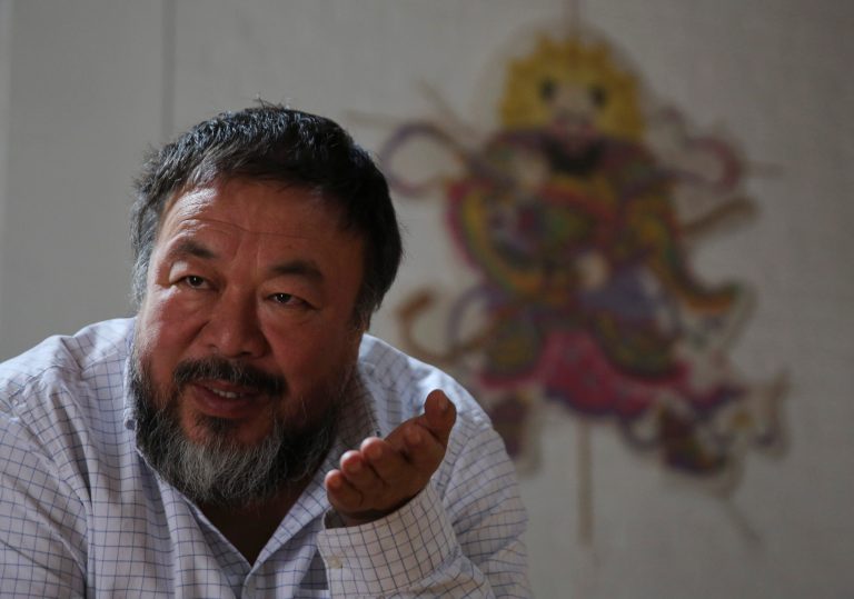 In this Tuesday, Sept. 16, 2014 photo, China outspoken Ai Weiwei speaks during an interview at his home in Beijing, China. Ai says Communist Party-run China has lost its basic principles and that it thwarts critics with underhanded ploys such as the dissident artistâs back-taxes case chronicled in a new documentary. (AP Photo/Andy Wong)