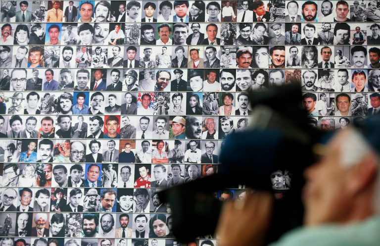 A wall of photographs of journalists killed while reporting the news lines a wall during the rededication of the Journalists Memorial at the Newseum in Washington, Monday, June 9, 2014. The memorial, which recognizes journalists killed while covering the news, added 10 names of journalists who were killed in 2013. (AP Photo/Charles Dharapak)