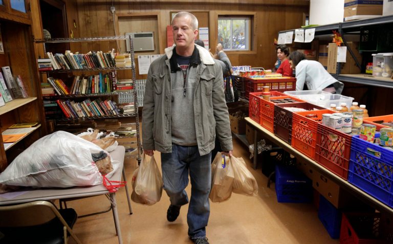 According to the Food Research Action Center, SNAP participation averaged 45.5 million people in September 2015, a decrease of almost 1.1 million compared with September 2014. (AP Photo/M. Spencer Green)