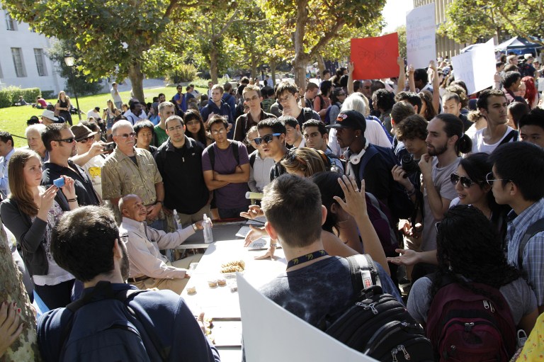 Two-in-three people say colleges should admit students based on grades, not a person's ethnicity. (AP Photo/Ben Margot)