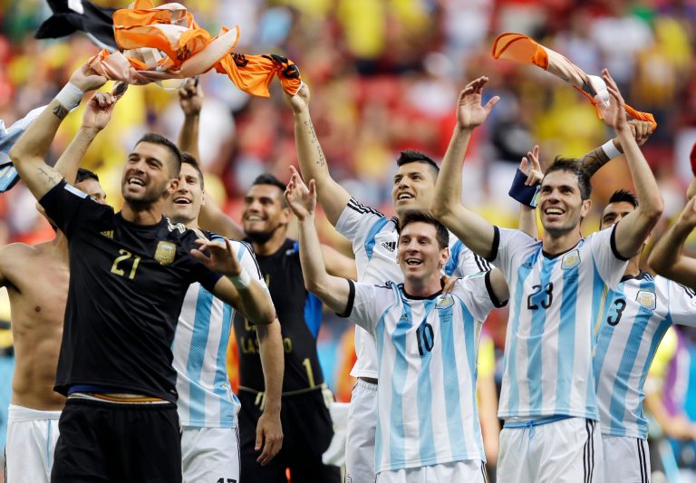 Argentina's Lionel Messi (10) and his teammates celebrate following their 1-0 victory over Belgium to advance to the semifinals after the World Cup quarterfinal soccer match at the Estadio Nacional in Brasilia, Brazil, Saturday, July 5, 2014. (AP Photo/Kirsty Wigglesworth)