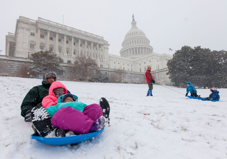 Officials warned in a memo that police will be monitoring sledding and other snow activities on the Capitol grounds and could intervene if things begin to look dangerous. (AP Photo/J. Scott Applewhite)