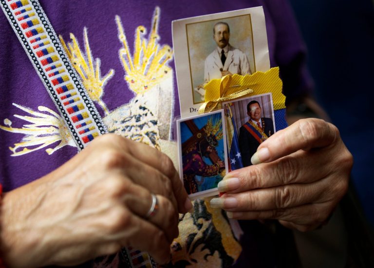   A woman holds a trio of images showing Venezuelan St. Jose Gregorio Hernandez, top, renowned as the ``Doctor of the Poor''; a laminated holy card of Jesus Christ; and an image of Venezuela's President Hugo Chavez, right, at a church service where supporters of the ailing president gathered to pray for his health, in Caracas,Venezuela, Thursday, Dec. 13, 2012. Venezuelans were warned that Chavez may not be well enough after his fourth cancer-related surgery in Cuba to be inaugurated on Jan. 10. (AP Photo/Fernando Llano)  