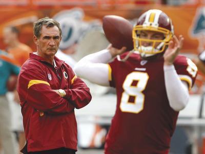 Hans Deryk/AP
Mike Shanahan, left, decided to go back to Rex Grossman at quarterback but didn't get different results against the Dolphins.