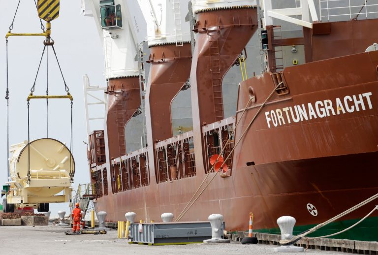 In this Monday, April 21, 2014 photo, the Amsterdam-bound Fortunagracht is loaded with road equipment to build highways, at the Port of Cleveland in Cleveland. The Commerce Department releases first-quarter gross domestic product on Wednesday, April 30, 2014.  (AP Photo/Tony Dejak)