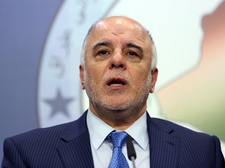 FILE - In this Tuesday, July 15, 2014 file photo, Shiite lawmaker and Deputy Parliament Speaker Haider al-Ibadi speaks to the media after an Iraqi parliament session in Baghdad.  On Monday, Aug. 11, 2014, Iraq's largest coalition of Shiite political parties chose al-Ibadi to be its candidate to lead the government in a major defeat for incumbent Prime Minister Nouri al-Maliki just hours after he declared himself the rightful candidate and put troops on the street. Critics say the Shiite al-Maliki contributed to the crisis by monopolizing power and pursuing a sectarian agenda that alienated the country's Sunni and Kurdish minorities. (AP Photo/Hadi Mizban, File)