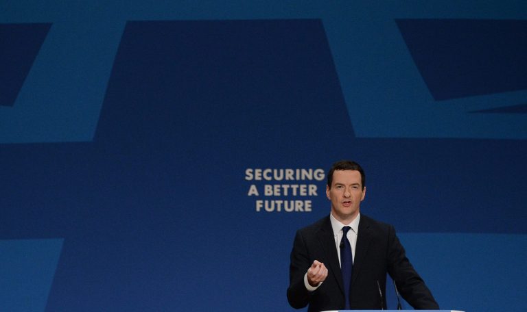 Britain's Chancellor of the Exchequer, George Osborne, makes his keynote address to the annual Conservative Party conference at the International Convention Centre in Birmingham, England, Monday Sept. 29, 2014. Osborne said working age benefits will have to be frozen for two years, in a fresh assault on welfare spending. Osborne told the Conservative Party conference that it was unfair that increases in state help outstripped pay rises since the start of the recession. (AP Photo/PA, Stefan Rousseau)  UNITED KINGDOM OUT  NO SALES  NO ARCHIVE