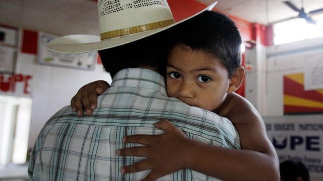 Perry defends immigration record