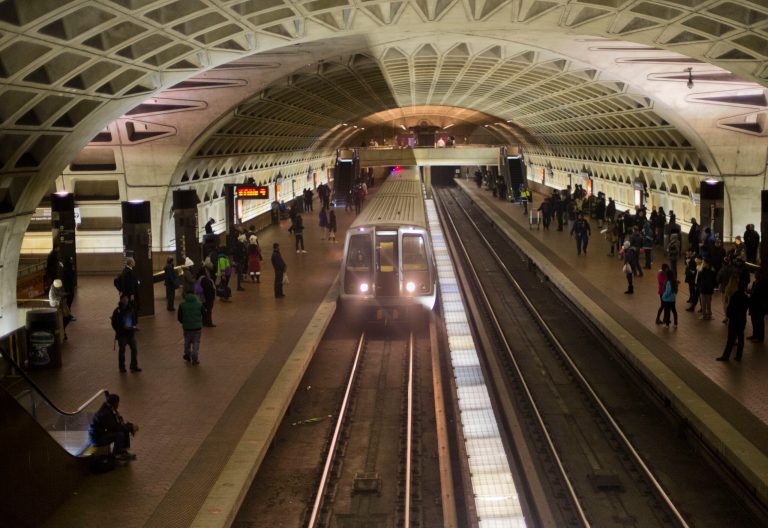 A subway train arrives at the L'Enfant Metro Station in Washington, Tuesday, Jan. 13, 2015, which is part of the public mass transit network for Washington. The transit network in the nation's capital, remains hobbled after an electrical malfunction that filled a L'Enfant Metro subway station with smoke, killing one woman and sending dozens of people to hospitals. (AP Photo/Pablo Martinez Monsivais)