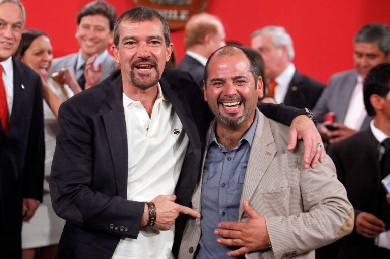 The Spanish actor, Antonio Banderas, left, poses for photographers next to Mario Sepulveda, in Santiago, Chile, Friday Jan. 31, 2014. Sepulveda was one of the 33 miners who was trapped in a mine cave-in in Chile's Atacama desert in 2010. The Spanish star will play Sepulveda, who known as 