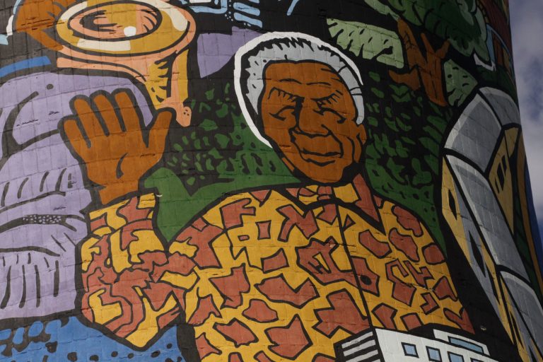   A giant portrait of former president Nelson Mandela adorns a cooling tower of a now defunct power station in Soweto, South Africa, Monday, Dec 10, 2012. Mandela underwent more unspecified medical tests in a military hospital in Pretoria, South Africa, as the public and journalists outside continued to ask the same, as of yet unanswered questions: What, if anything, is wrong with the 94-year-old anti-apartheid icon. (AP Photo/Denis Farrell)  