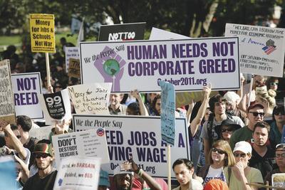 Anti-capitalism protesters march toward the Chamber of Commerce in Washington on Thursday.-Graeme Jennings/Examiner