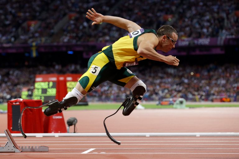 FILE -  In this Sunday, Aug. 5, 2014 file photo South Africa's Oscar Pistorius starts in the men's 400-meter semifinal during the athletics in the Olympic Stadium at the 2012 Summer Olympics, London.  Pistorius is free to compete for South Africa again, as long as his running doesn't go against the ruling of the judge. Pistorius, who is to be sentenced next month after being found guilty in the negligent killing of his girlfriend, could compete at any time because the South African Olympic committee has no regulations preventing someone with a criminal record from representing the country. (AP Photo/Anja Niedringhaus, File)