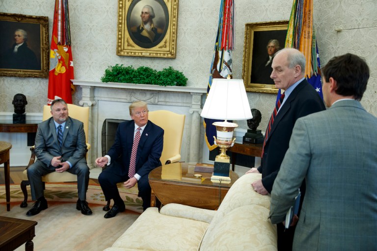 President Donald Trump speaks with White House Chief of Staff John Kelly, second from right, and White House deputy press secretary Hogan Gidley, right, after meeting with Don Bouvet, left, in the Oval Office of the White House, Friday, Feb. 9, 2018, in Washington. (AP Photo/Evan Vucci)