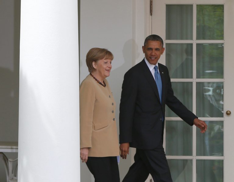 President Barack Obama and German Chancellor Angela Merkel arrive for their joint news conference in the Rose Garden of the White House in Washington, Friday, May 2, 2014. Obama and Merkel are putting on a display of trans-Atlantic unity against an assertive Russia, even as sanctions imposed by Western allies seem to be doing little to change Russian President Vladimir Putin's reasoning on Ukraine. (AP Photo/Charles Dharapak)