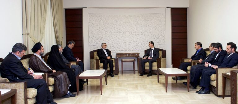 In this photo released by the Syrian official news agency SANA, Syrian President Bahsar Assad, center right, speaks during a meeting with Alaeddin Boroujerdi, center left, head of Iran's parliamentary committee on national interest and foreign policy, in Damascus, Syria, Monday, April 22, 2013. Assad said during the meeting that the Middle East is being subjected to plans that targets its stability and unity of its territories. (AP Photo/SANA)