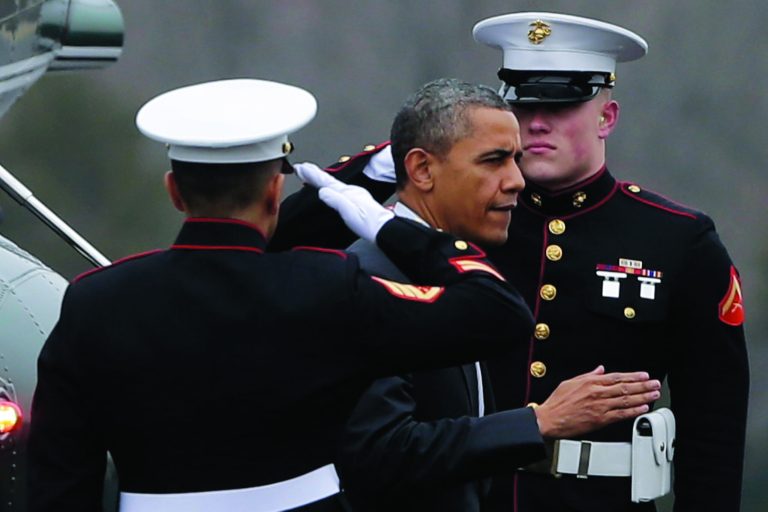 President Barack Obama steps off Marine One after landing at Leesburg Executive Airport Landing Zone in Leesburg, Va., Thursday, Feb. 7, 2013, before attending the House Democratic Issues Conference in Lansdowne, Va. (AP Photo/Charles Dharapak)