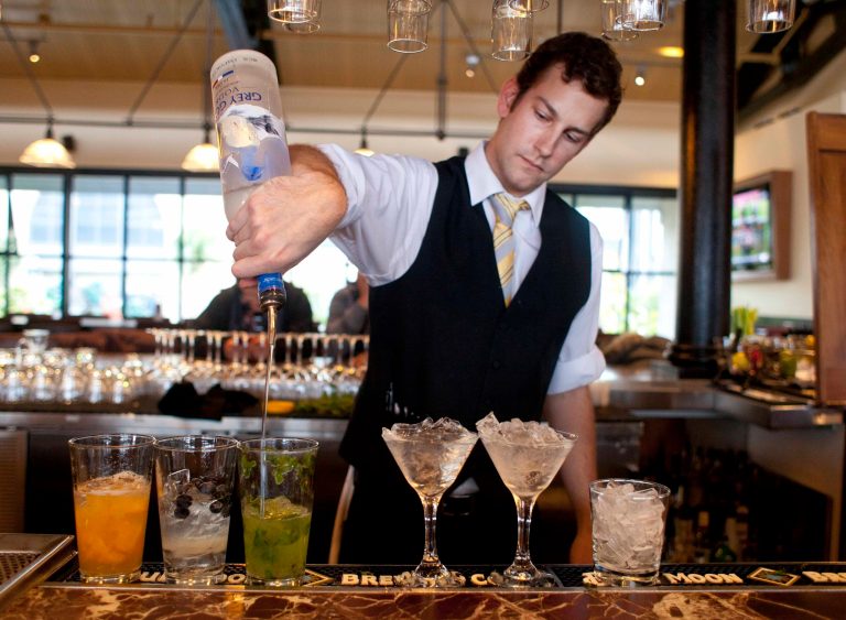   In this photo taken Monday, Nov. 19, 2012, bartender Nico Reynders makes three different drinks from vodka at the Bistro Boudin in San Francisco. Booze with multiple personalities, like the best kind of party guests, can adapt to the situation and provide a festive little home bar that adds panache to your holiday party. (AP Photo/Eric Risberg)  