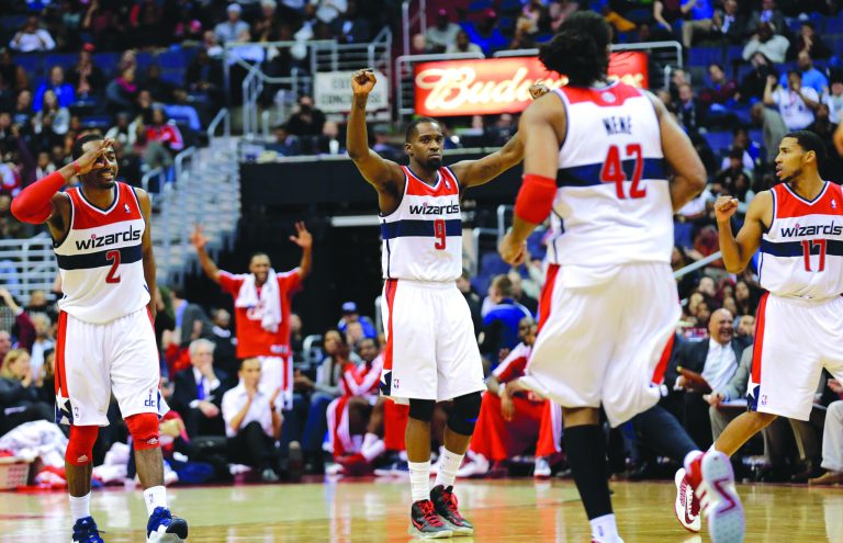 Alex Brandon/AP
John Wall, left, finished with 13 points and eight assists and forward Martell Webster, center, had a team-high 21 points as the Wizards knocked off the Clippers on Monday.