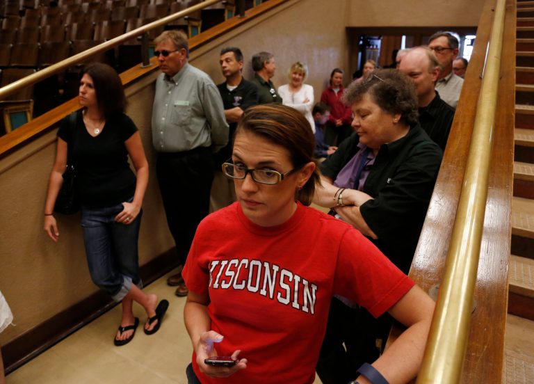   A woman waits to cast her ballot Tuesday, June 5, 2012, in Milwaukee. Wisconsin Republican Gov. Scott Walker is taking on Democratic challenger Tom Barrett in a recall election. (AP Photo/Jeffrey Phelps)  