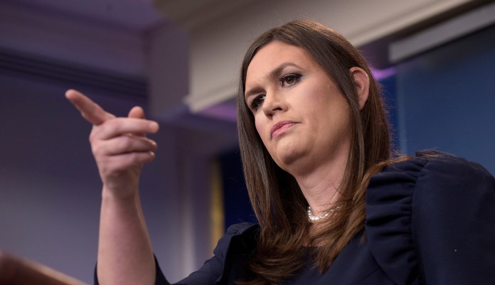 When pressed further over comments made by Chuck Rosenberg, the Drug Enforcement Administration's administrator, who said that the president was condoning "police misconduct," Sanders said that the comment was nothing more than a joke. (AP Photo/Susan Walsh)