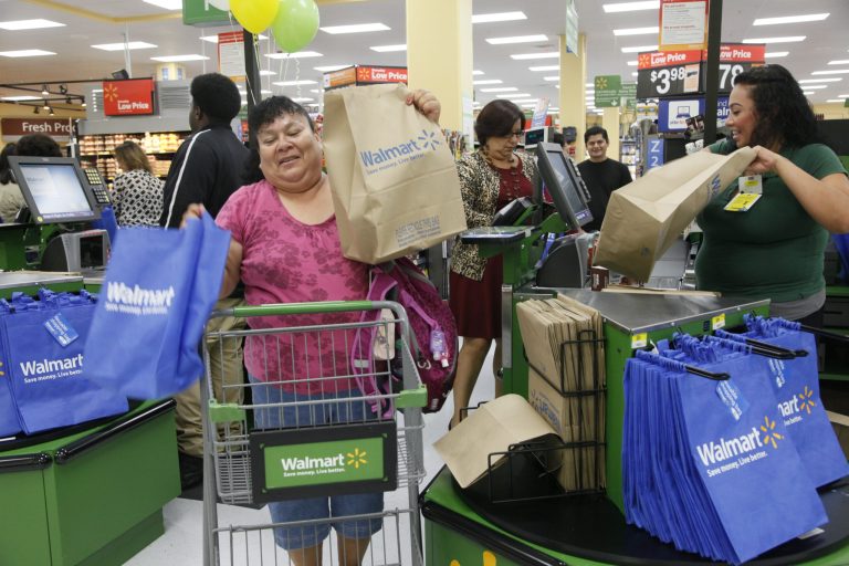 FILE - In this Thursday, Sept. 19, 2013, file photo, costumers shop at a new Walmart in Los Angeles. The government reports on sales at U.S. retailers in September on Tuesday, Oct. 29, 2013.