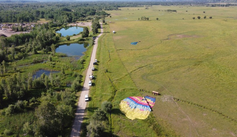 Two of three sightseeing balloons that crashed Monday, Aug. 3, 2020, are seen in an open area of Jackson Hole in western Wyoming. Between 16 and 20 people were hurt, officials said.