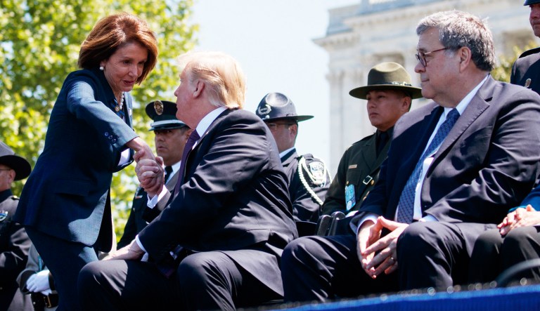 Attorney General William Barr looks on as President Donald Trump shakes hands with Speaker of the House Nancy Pelosi of Calif., during the 38th Annual National Peace Officers' Memorial Service at the U.S. Capitol, Wednesday, May 15, 2019, in Washington.