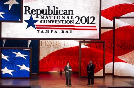 Republican National Committee Chairman Reince Priebus, left, and convention CEO William Harris unveil the stage and podium for the 2012 Republican National Convention, Monday, Aug. 20, 2012, at the Tampa Bay Times Forum in Tampa, Fla. (AP Photo/Scott Iskowitz)
