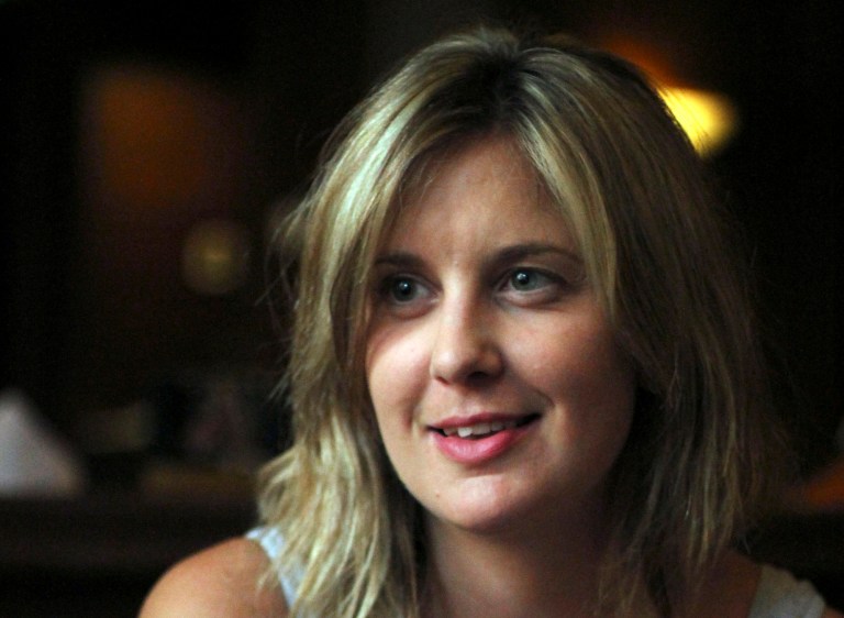   Australian advertising executive Anna Bartsch, a survivor of a Christmas Day crash-landing of a Fokker 100 jet, speaks about terrifying tales of escape during an interview at a Yangon hotel where the airline lodged passengers after evacuating them from the scene, in Myanmar, Wednesday, Dec. 26, 2012. 