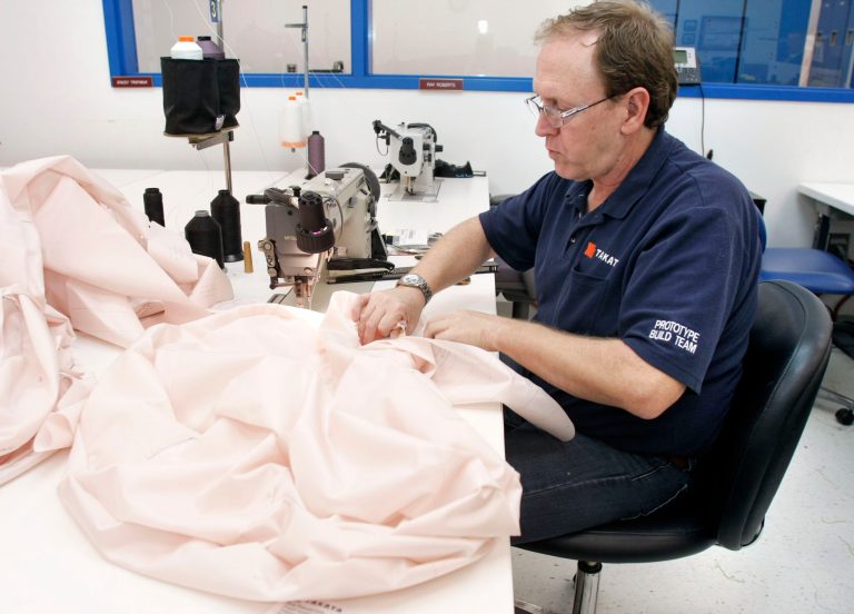 A Takata employee sews an airbag at Takata's current crash-testing facility August 19, 2010 in Auburn Hills, Michigan. (Photo by Bill Pugliano/Getty Images)