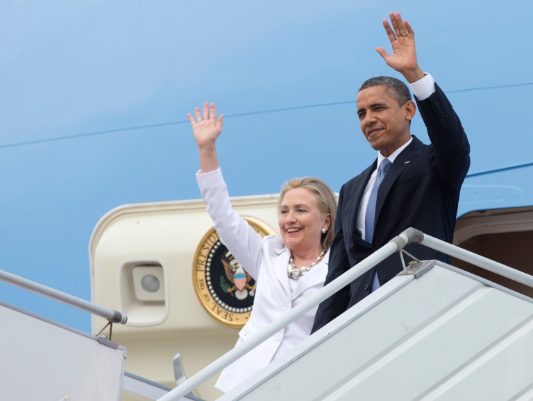 President Barack Obama and then-Secretary of State Hillary Rodham Clinton wave as they arrive at Yangon International Airport in Yangon, Myanmar, on Air Force One, Monday, Nov. 19, 2012. (AP Photo/Carolyn Kaster)