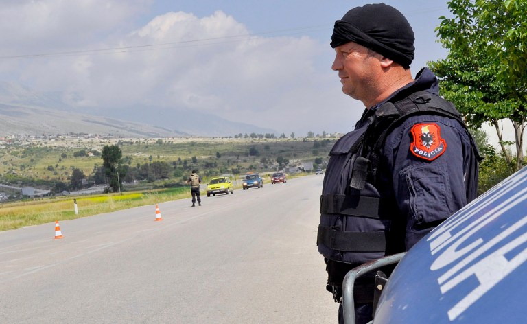 Members of the Albanian police force patrol the southern village of Lazarat, 200 kilometers (125 miles) south of capital Tirana, Albania, Monday, June 16, 2014. Albanian authorities say hundreds of police trying to enter a lawless marijuana-growing southern village have been fired at with rocket-propelled grenades, mortars and machine guns. A police statement says nobody was hurt in the pre-dawn attack by suspected drug gang members outside Lazarat, home to some 3,000 people. (AP Photo)