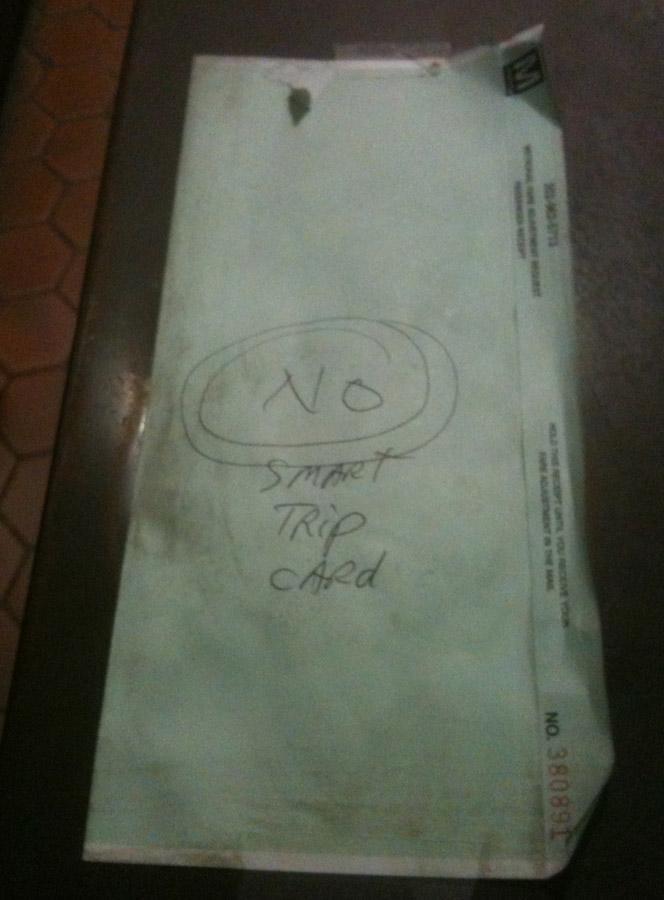A handwritten sign was still in use at an Eastern Market station faregate Thursday, despite the agency's efforts to use printed signs instead. 