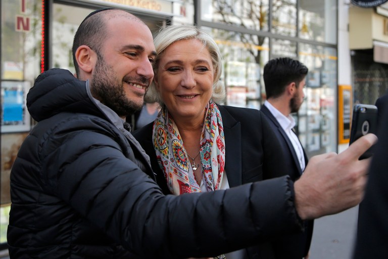 In France, there was a clear distinction between metro Paris and the rest of the nation. (AP Photo/Michel Euler)