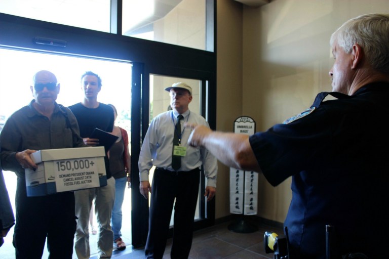Activists attempted to shutdown proceedings at an oil lease sale at the Superdome in New Orleans on Wednesday. (AP Photo/Janet McConnaughey)