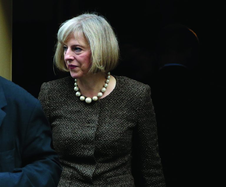 Britain's Home Secretary Theresa May leaves 10 Downing Street in London, Tuesday, Oct. 16, 2012, following a cabinet meeting. Britain's Home Secretary is set to rule on whether to extradite a British hacker to America later today, to face charges for breaking into sensitive computer networks at U.S. military and space installations. (AP Photo/Alastair Grant)