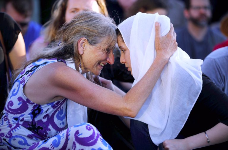 The mother of one of the men killed while defending two women from a man hurling anti-Muslim slurs urged Trump to 