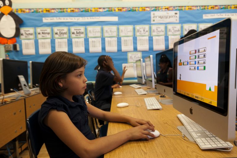 In this photo taken Tuesday, May 15, 2012, Ritter Elementary School elementary student Fatima Escalante 9, practices her math operator skills in Los Angeles. (AP Photo/Damian Dovarganes)