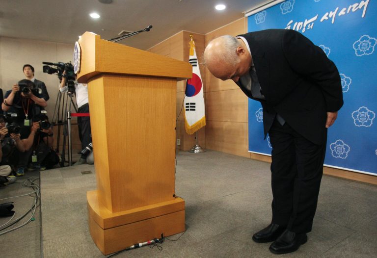 Newly-nominated South Korean Prime Minister Moon Chang-keuk bows to the nation during a news conference about his resignation at the government complex in Seoul, South Korea, Tuesday, June 24, 2014. Moon has withdrawn from consideration following mounting criticism over his alleged pro-Japanese remarks in the past.(AP Photo/Ahn Young-joon)