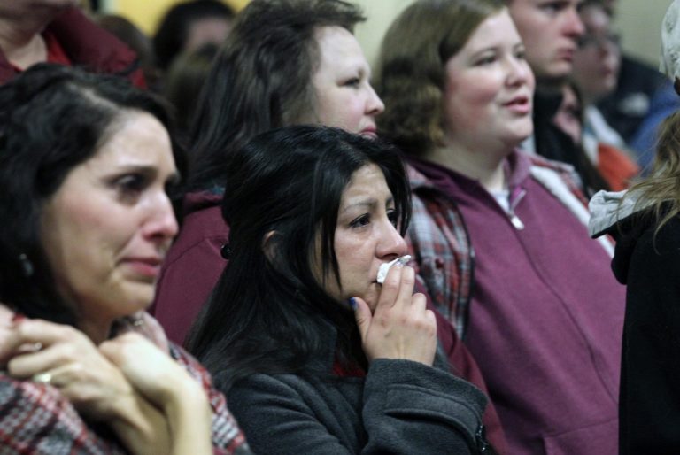   Family members and friends of a 6-year-old Emilie Parker, killed in last week's Connecticut school shooting, look on during a memorial service Thursday, Dec. 20, 2012, at the Ben Lomond High School, in Ogden, Utah. Family members who brought blond-haired Emilie Parker back to Utah for her burial remembered the 6-year-old killed in the Connecticut school shooting as a 