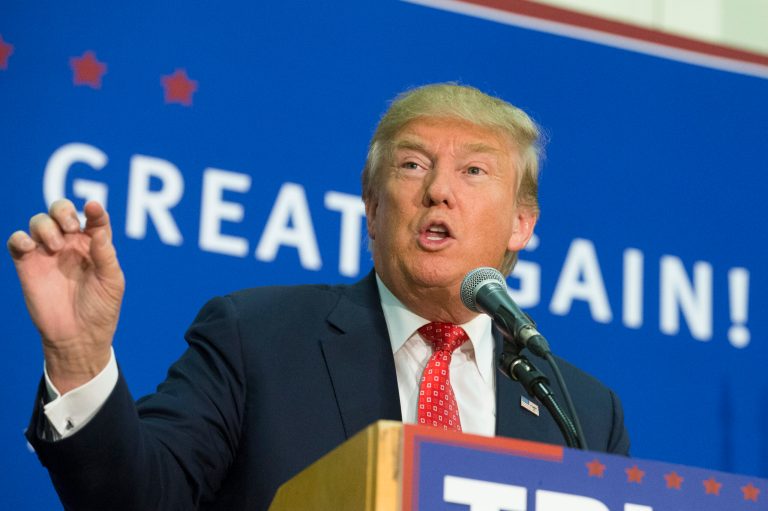 Just weeks before the tight Iowa race, Donald Trump is well ahead in the latest national poll among GOP candidates. (AP Photo/John Minchillo)