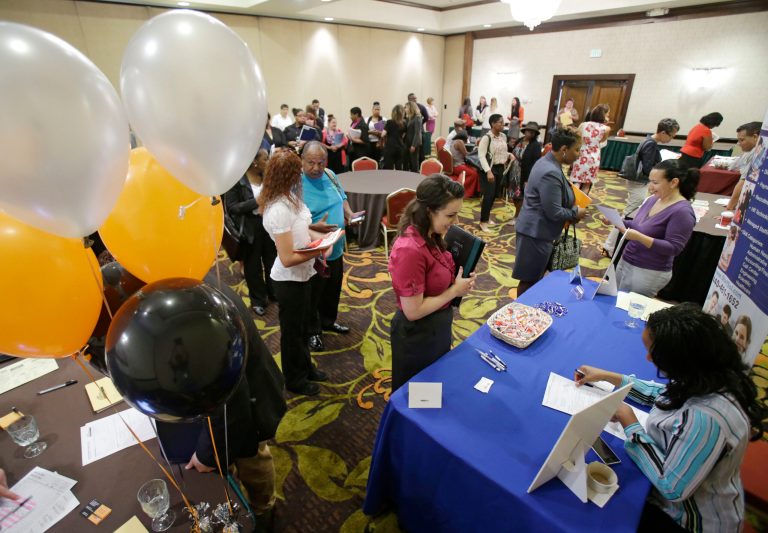 In this June 12, 2014 photo, Laura MacDonald, 25, interviews for an administrative sales position at the Cleveland Career Fair in Independence, Ohio.  The U.S. Labor Department reports on the number of people who applied for unemployment benefits last week. The report will be released Thursday Sept. 11, 2014 at 8:30 a.m. Eastern.(AP Photo/Tony Dejak)