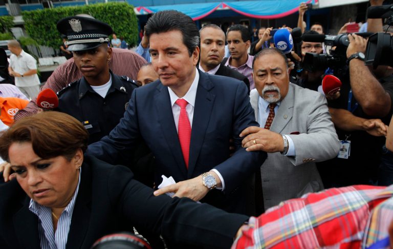 Panamanian Supreme Court judge Alejandro Moncada Luna, center, leaves the National Assembly building after appearing in front of a committee after being suspended on corruption allegations, in Panama City, Monday, Oct. 20, 2014. Justice Moncada Luna linked to former Panamanian President Ricardo Martinelli was suspended in a landmark corruption case that alleges that he profited from his ties to the former conservative leader. As part of the ruling by lawmakers leading an impeachment probe, Moncada's assets were temporarily frozen. He was also ordered to turn over his passport and remain confined to his residence. (AP Photo)