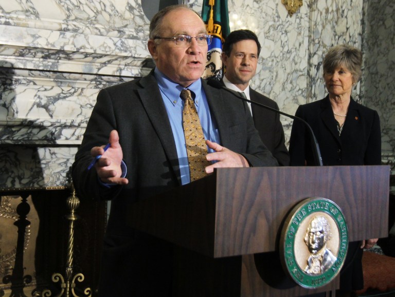 FILE - In this April 3, 2013 file photo, Sen. Jim Hargrove, D-Hoquiam, talks to reporters in Olympia, Wash. Hargrove is one of the budget writers on a Washington state plan proposing to move some government workers out of a state-sponsored health plan and into an exchange developed under President Barack Obama's health care law. (AP Photo/The Olympian, Steve Bloom, file)